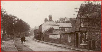 The street at Coton, with figures and a horse in the road.