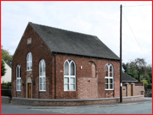 The Ebenezer Chapel, a brick building with arched windows on a corner.