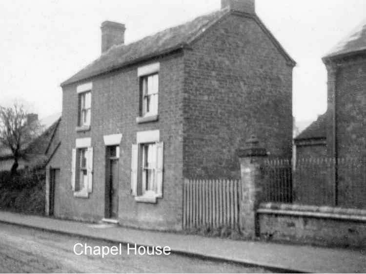 Chapel House: a brick house with gate piers.