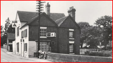 The Navigation public house, with a motor car outside.